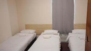 Postel nebo postele na pokoji v ubytování Alma Villa