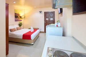 Postel nebo postele na pokoji v ubytování Ban Chang Pet-friendly Hotel by SCN