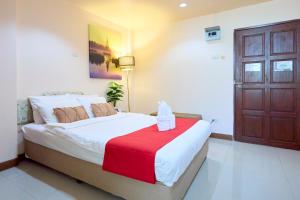 Postel nebo postele na pokoji v ubytování Ban Chang Pet-friendly Hotel by SCN