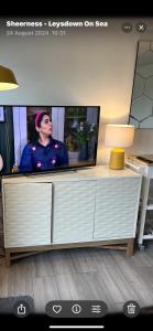 a tv sitting on top of a desk at Chic Chalets in Sheerness