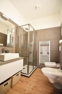 a bathroom with a shower and a sink and a toilet at Sant'Andrea - soggiorna a due passi dalla storia in Padova