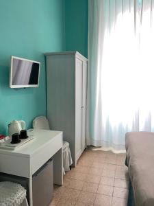 Televízia a/alebo spoločenská miestnosť v ubytovaní Guest House Meret