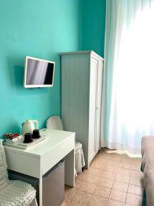 Televízia a/alebo spoločenská miestnosť v ubytovaní Guest House Meret