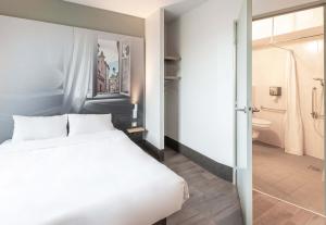 Postel nebo postele na pokoji v ubytování B&B HOTEL Toulouse Basso Cambo