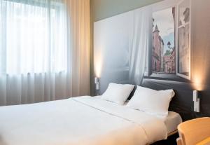 Postel nebo postele na pokoji v ubytování B&B HOTEL Toulouse Basso Cambo