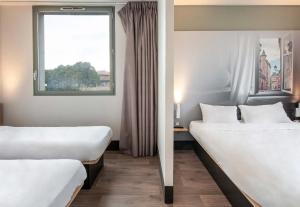 Postel nebo postele na pokoji v ubytování B&B HOTEL Toulouse Basso Cambo