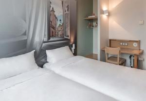Postel nebo postele na pokoji v ubytování B&B HOTEL Toulouse Basso Cambo