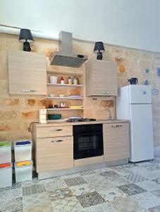 A kitchen or kitchenette at Al Console Le Dimore Apartment
