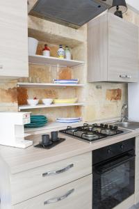 A kitchen or kitchenette at Al Console Le Dimore Apartment