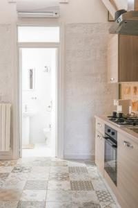 A kitchen or kitchenette at Al Console Le Dimore Apartment