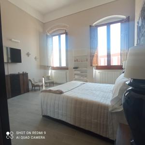 A bed or beds in a room at Al Console Le Dimore Apartment