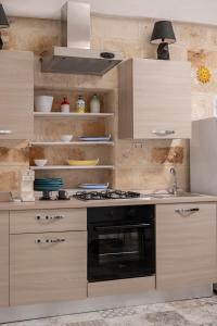 A kitchen or kitchenette at Al Console Le Dimore Apartment
