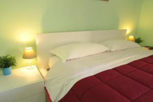 Postel nebo postele na pokoji v ubytování B&B La Muraglia