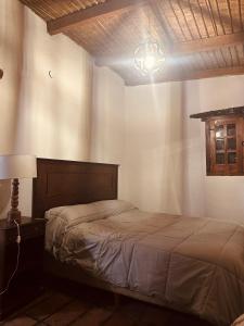 En eller flere senge i et værelse på Casa Los Membrillos