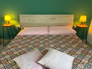 Posteľ alebo postele v izbe v ubytovaní Assajè Guestroom