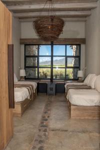 Ένα ή περισσότερα κρεβάτια σε δωμάτιο στο Casa Ranchitos