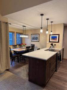 a kitchen and dining room with a table and a dining room at Cozy 2BDR with Stunning Location Near Town and Lifts in Breckenridge