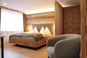 Postel nebo postele na pokoji v ubytování Hotel Gasthof Walcher