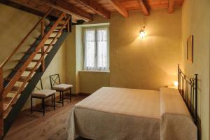 Ένα ή περισσότερα κρεβάτια σε δωμάτιο στο Cascina Le Preseglie