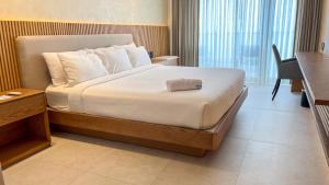 Ένα ή περισσότερα κρεβάτια σε δωμάτιο στο MantaHost Hotel