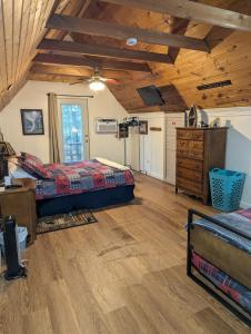 a bedroom with two beds and a wooden ceiling at A New A-Frame of Mind Cabin in Birnamwood