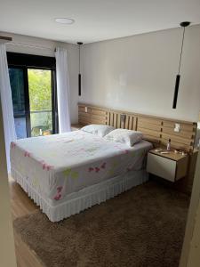 Ένα ή περισσότερα κρεβάτια σε δωμάτιο στο HospedagemFeliz