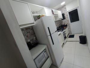Dapur atau dapur kecil di Flat confortável e excelente para relaxar com a família