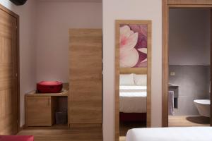 Postel nebo postele na pokoji v ubytování Luci di Assisi B&B Wellness