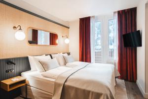 Braunbär Hotel & Spa - Former Alpine Sunstar Hotel客房内的一张或多张床位