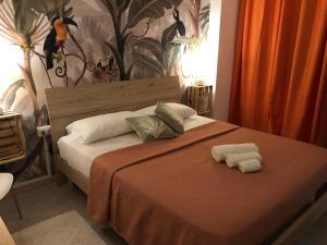 Posteľ alebo postele v izbe v ubytovaní Assajè Guestroom
