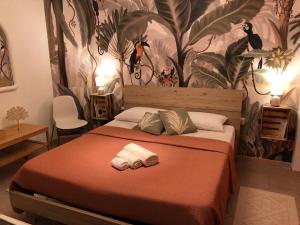 Posteľ alebo postele v izbe v ubytovaní Assajè Guestroom