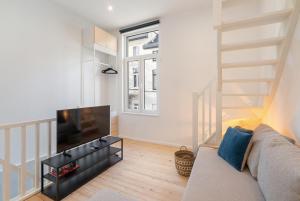 Posezení v ubytování Gezellig, knusse en gerenoveerde rijwoning 4p