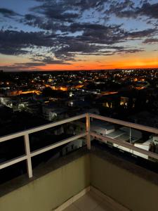a view of a city at night from a balcony at Departamento en Gualeguay in Gualeguay