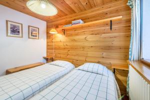 Letto o letti in una camera di Chalet complet