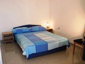 Posteľ alebo postele v izbe v ubytovaní Apartments and Rooms Florijan + 20 fotografií