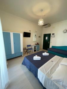 Postel nebo postele na pokoji v ubytování Hotel Dei Platani