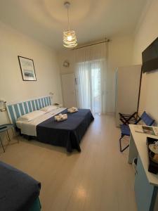 Postel nebo postele na pokoji v ubytování Hotel Dei Platani