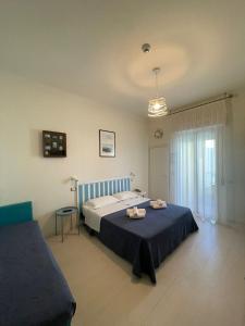 Postel nebo postele na pokoji v ubytování Hotel Dei Platani