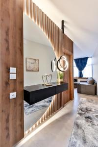 a hallway with a circular stairway in a house at Apollon Suite in Thessaloniki