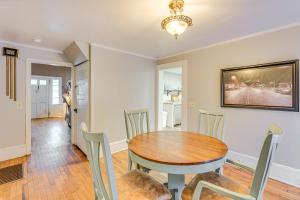 a dining room with a wooden table and chairs at Near Murphy River Walk Historic Downtown Home! in Murphy