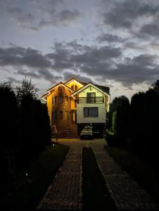 a house with a camper parked in front of it at Casa Letca montain in Sohodol