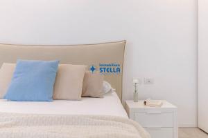 Postel nebo postele na pokoji v ubytování Cala Blu + 37 fotografií