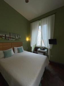 Posteľ alebo postele v izbe v ubytovaní Guest House Meret