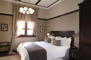 Postel nebo postele na pokoji v ubytování Hotel Boutique Castillo Rojo