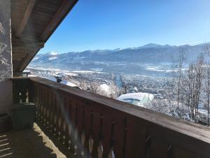a balcony with a view of a snow covered mountain at Alpendohle Apartments Innsbruck in Innsbruck