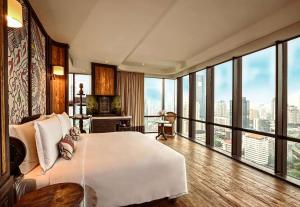 Voodi või voodid majutusasutuse The Orient Jakarta, a Royal Hideaway Hotel toas