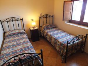 Un pat sau paturi într-o cameră la La Rosa Dell'alba
