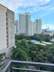a view of a city from the balcony of a building at Cityscape Grand Tower Cebu - 2 Bedrooms with Balcony Close to Ayala Mall - New Condo in Cebu City