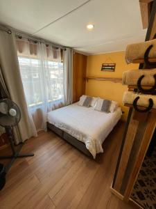 Ένα ή περισσότερα κρεβάτια σε δωμάτιο στο Umantü Hostel