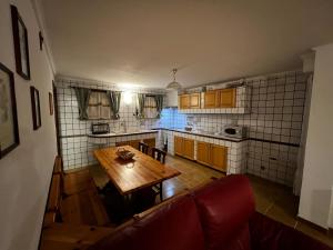 an overhead view of a kitchen with a wooden table at Spacious Apartments - 5 min Ciampino airport by car -sleeps 6 - Easy Train to Rome- LA MAISON in Ciampino +23 photos